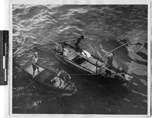 Boat merchants in Hong Kong harbor, China, 1947