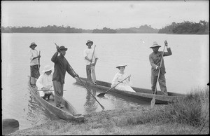 The missionary Paul-Elie Vernier and his wife, with native paddlers, on two canoes