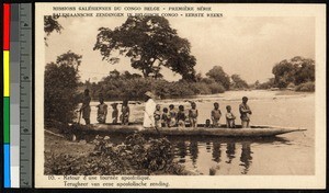 Missionary father standing in a small boat, Congo, ca.1920-1940