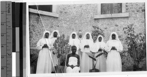 Group portrait of a Priest and Sisters, Africa, September 9, 1947