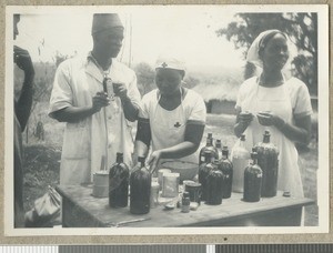 Drugs table at an outdoor clinic, Eastern province, Kenya, ca.1949