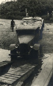 Car going on a ferry, in Gabon