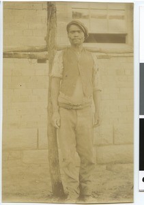 African man in front of a house, Empangweni, South Africa