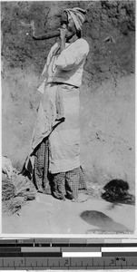 Ilocano woman smoking, Philippines, ca. 1930