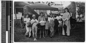 Sister Pieta Kirby, MM, on a picnic with seven girls, Heeia, Hawaii, 1929