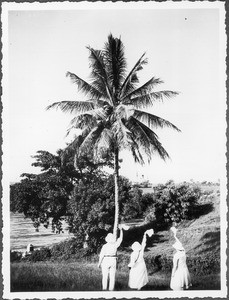 Three people waving at a steamer leaving Tanga, Tanzania, 1927