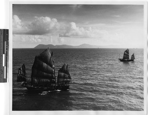 Two boats under sail in Hong Kong harbor, China, 1947