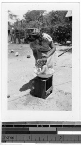 Mother bathing her child, Carrillo Puerto, Quintana Roo, Mexico, ca. 1947