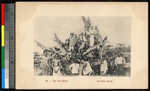 People standing atop a tangled pile of logs, Congo, ca.1920-1940