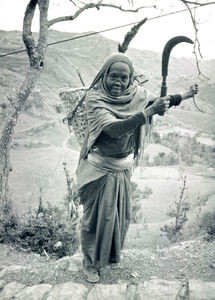 Nepal 1986. A woman is collecting firewoods. She is a laborer at the United Mission Hospital, T