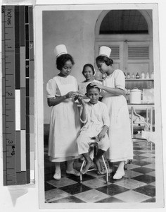 Ear irrigation for Catholic school boy at St. Paul's Hospital, Manila, Philippines, October 31, 1927