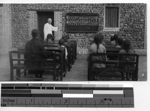 Fr. McRae teaching at St. Joseph's school at Dawan, China, 1931