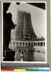 Hindu temple and man worshipping an idol, Vārānasi , India, ca. 1920