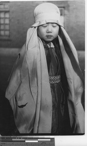 A child dressed as the Blessed Virgin at Fushun, China, 1936