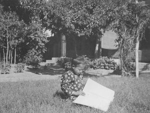 Blind home Blind School in Mukden. A schoolgirl studying at her lesson