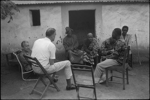 Rev. Jacques Maury talking with people among whom two fetichist men