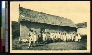 Group waiting by a chapel for the service to begin, Madagascar, ca.1920-1940