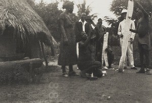 Missionary and weavers, Nigeria, 1936