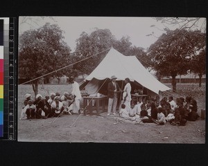 Doctor with group of patients attending medical tent, Andhra Pradesh, India, ca. 1920