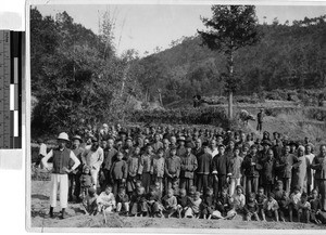 Large group of townspeople assembled in a field, Kaying, China, ca. 1940