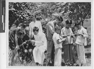 Fr. Pulaski teaching prayers at Jiangmen, China, 1950