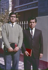 Two men in front of church of Christ building