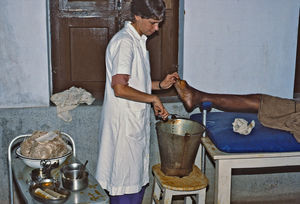 Danish Bangladesh Leprosy Mission/DBLM. Missionary, sister Bente Birkmose Jakobsen changing a d