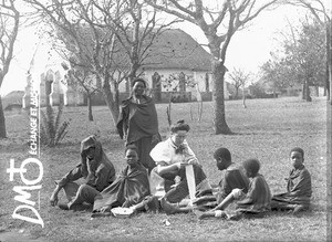 European woman and African people in front of a chapel, Valdezia, South Africa, ca. 1896-1911