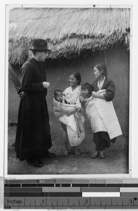 Father Carroll talking to two women, Masan, Korea, ca. 1920-1940