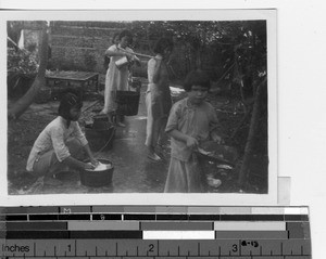 Blind girls working in the courtyard at Yangjiang, China, 1949