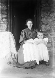 Young European woman and a child on the veranda, Tanzania, ca.1893-1920