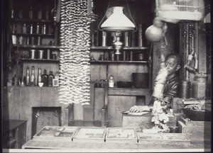 An apothecary and dentist with teeth hung up on display