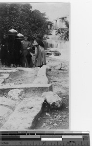 Maryknoll Sisters with Chinese wearing large hats in Yangjiang, China