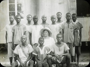 Young men with female missionary, Congo, ca. 1920-1930