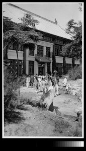 Students coming out of Ninde Chapel, Yenching University, Beijing, China, 1931