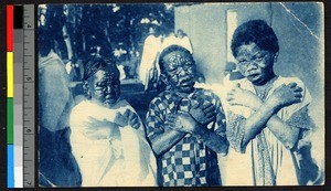 People suffering from leprosy stand with arms crossed before them, Madagascar, ca.1920-1940