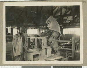 Men toiling in the workshop, Chogoria, Kenya, ca.1953