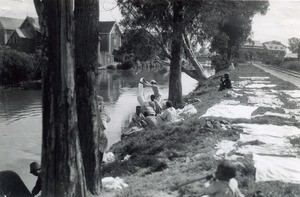 Women washing their laundry in the canal of Isotry, Madagascar