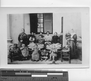 A Nun and women caring for orphans in China