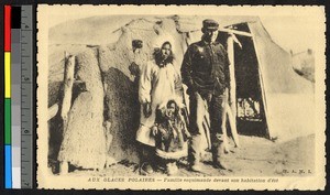 Family standing outside of a hide tent, Canada, ca.1920-1940