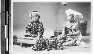 Two children preparing vegetables, Japan, ca. 1920-1940