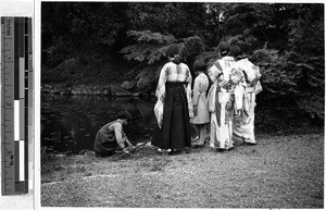 Girl fishing in the church yard, Hikone, Japan, ca. 1938