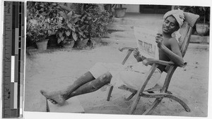 Man reading The Field Afar, India, ca. 1900-1920