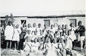 Pupils of the sewing class in Qalo, with Mrs G. Atger