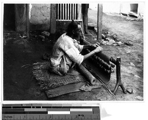 Korean man weaving a mat, Korea, ca. 1920-1940