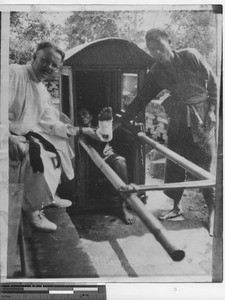 Brother Dorsey with patients at Dongzhen China, 1923