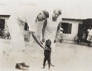 Emily Godfrey, male missionary and walking infant, Nigeria, ca. 1934