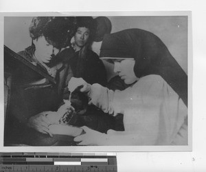 Maryknoll Sister gives medical attention at Fushun, China