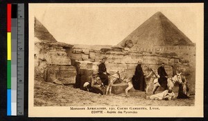 Three missionary fathers on donkeys with pyramids in the background, Egypt, ca.1920-1940