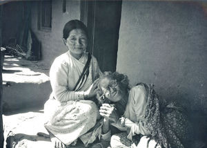 Outside the United Mission Hospital Tansen, Nepal 1986. Women are delousing each other